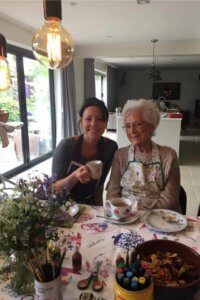 Specialist care services-elderly lady having tea with carer